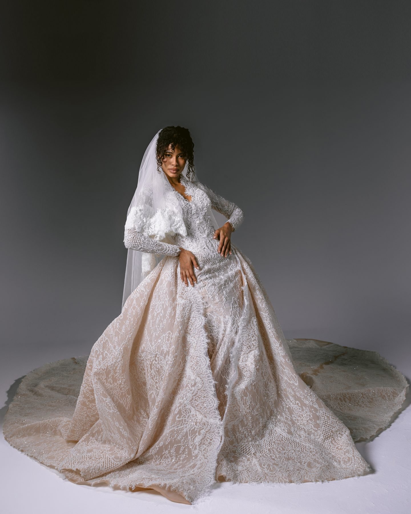 Seated bride in a full embroidered ballgown